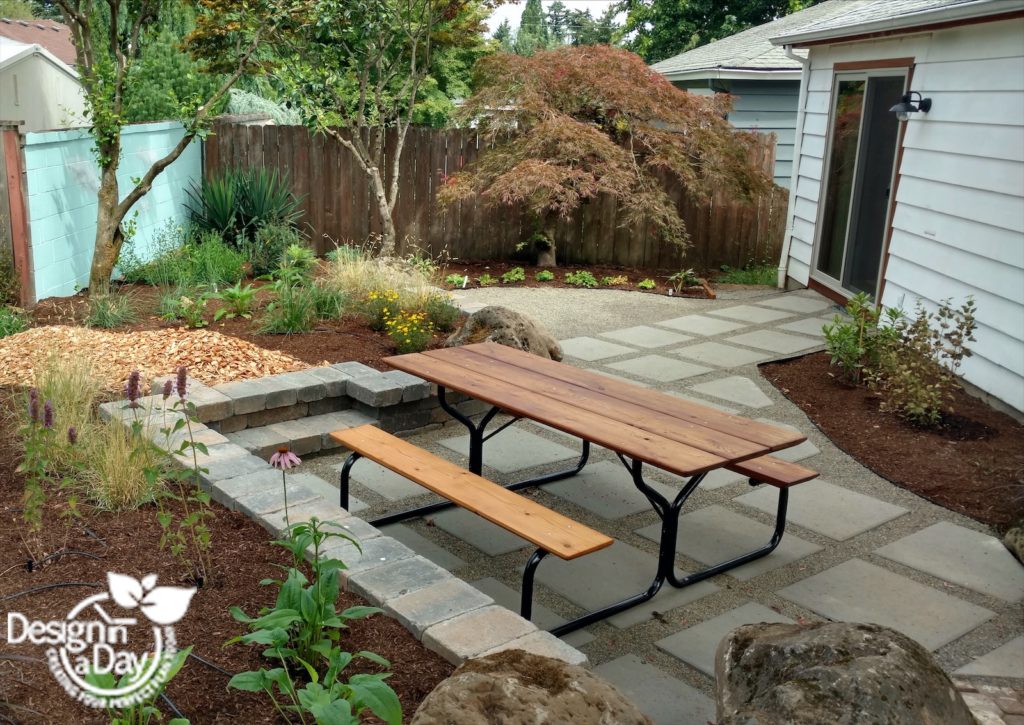 Concrete pavers on the angle create more useable space in this mid century backyard garden home in Portland Oregon