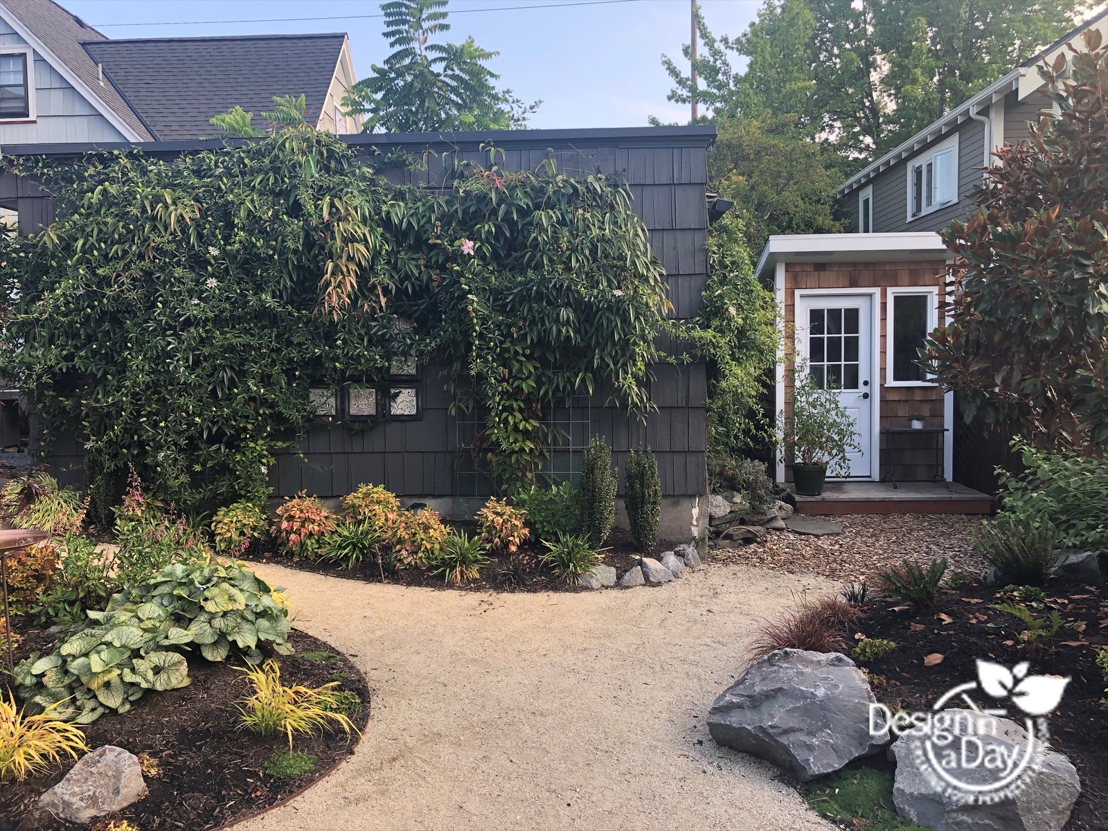 Outdoor living landscaping with granite path and custom shed in Grant Park neighborhood.
