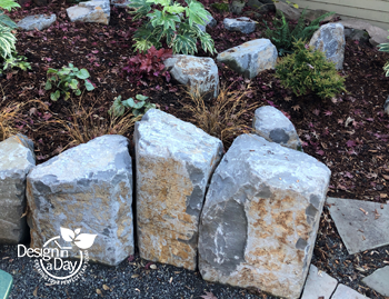 Boulders create interest for gas fire pit patio