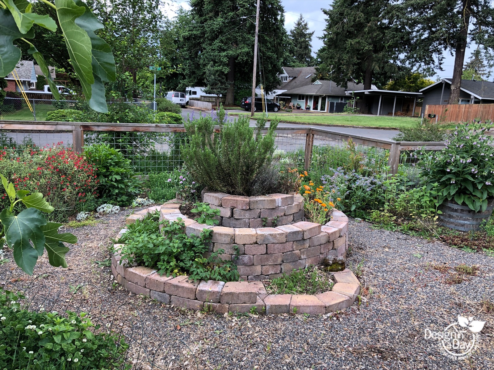 Portland front yard landscape has whimsical herb garden.