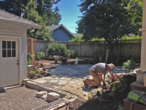 Installing the patio Grant Park N. E. Portland Landscape Design in a Day in this dog friendly garden.