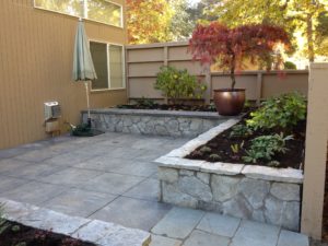 courtyard uses hardscape planters to allow easy planting area for senior living