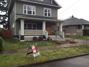 Before photo shows beautiful Portland home with unattractive front landscape