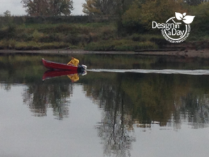 Portland landscape designers' view of fall fisherman in red boat