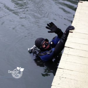 Floating home Multnomah Channel diver checks floatation 